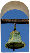 A bell with a wooden handle hanging from it.